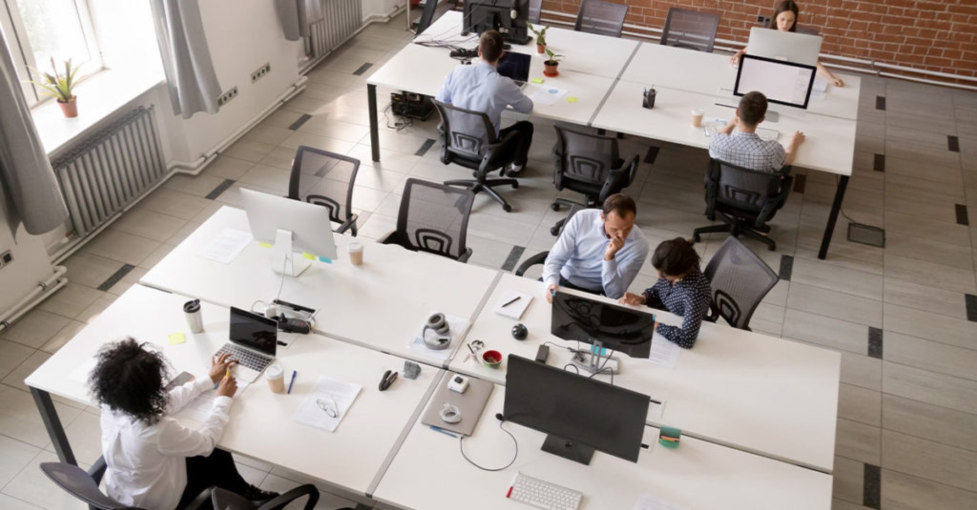 Focused individual workspace with desk and monitor